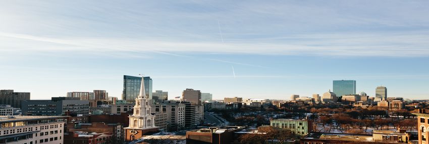 Photograph of the Boston Skyline in the morning with no clouds in the sky