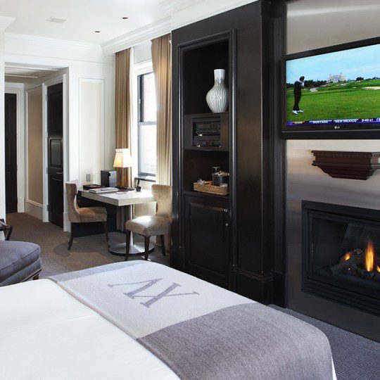 Contemporary Classic Room - 395 square feet. Sitting area with a Chaise Lounge, fireplace and 42" flat screen TV. Imported marble bathroom with rainforest shower and sunken whirlpool tub (combination). Work desk and King bed.