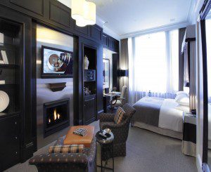 Part of the Gilbert Stuart Suite- Approximately 485 square feet with a luxurious sitting area and views of historic Beacon Street. In front of the fireplace – a love seat or two comfortable arm chairs with an ottoman, a 42" flat screen TV and a large wooden desk. Imported marble bathroom with rainforest shower and whirlpool tub (combination). Connecting rooms are 02/04. Queen OR King bed.
