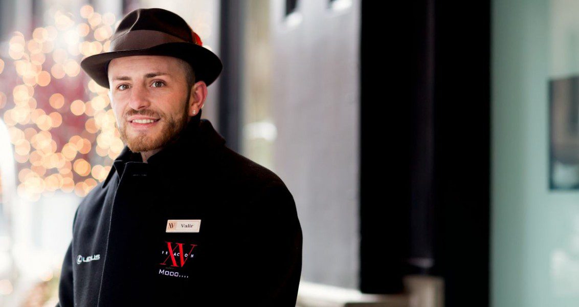 Our doorman standing outside in his winter fifteen beacon jacket.
