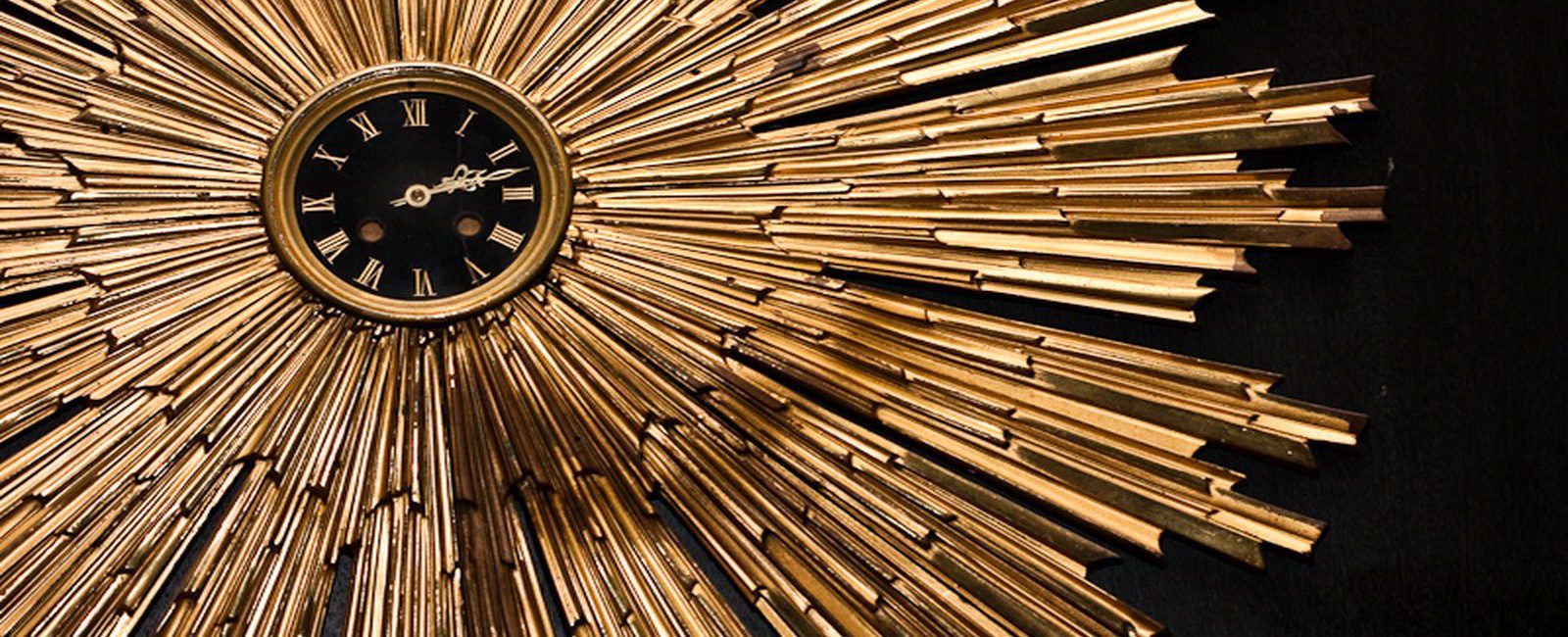 round gold clock that is featured in our hotel lobby.