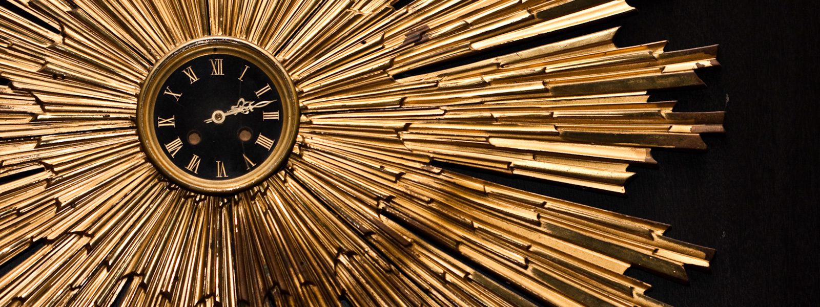 round gold clock that is featured in our hotel.