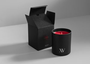 sleek black fifteen beacon candle that showcases our signature scent in the lobby of the hotel.