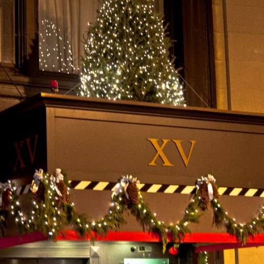 holiday decorations to the exterior of the XV Beacon hotel during christmas