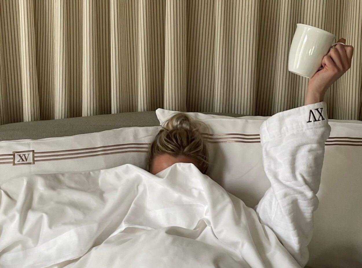 woman under XV Beacon Bed Covers