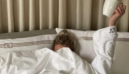 woman under XV Beacon Bed Covers