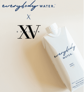 partnership between XV Beacon Hotel and Everybody water with our logo and their water bottle